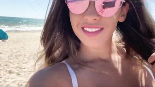 Briana Banderas undresses on a public beach to masturbate