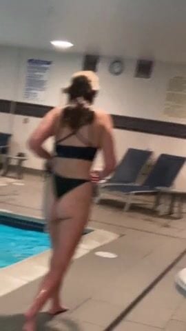 Candid sisters friend in bikini by the pool