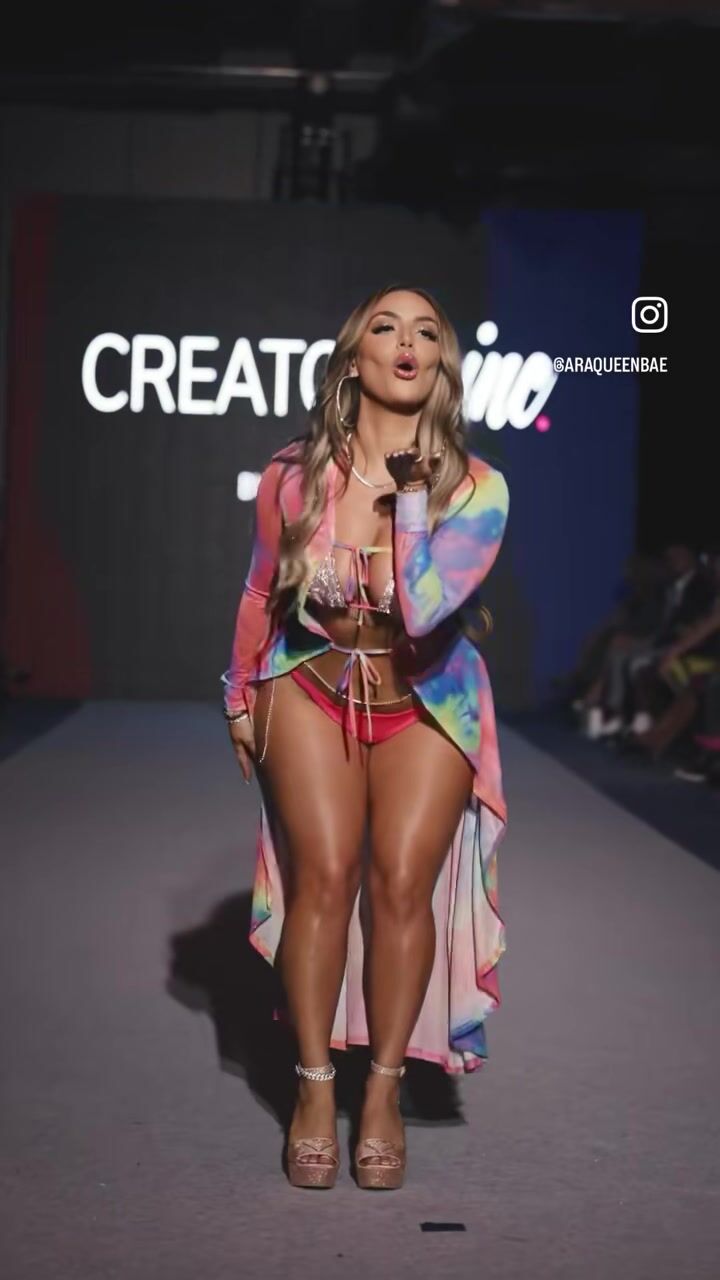 New York Fashion Week Show moments after the intruder ar the Creators Inc x Bossi Show. Brunette persian teen @IG : AraQueenBae walking cat walk NYFW at the Conrad Hotel Hilton Group in Tribeca wearing a rhinestone bikini paired with tiedye funky cover up